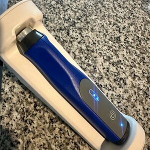 Blue and Gray Handheld Device with LED